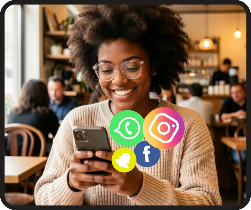 Black woman smiling using a smartphone